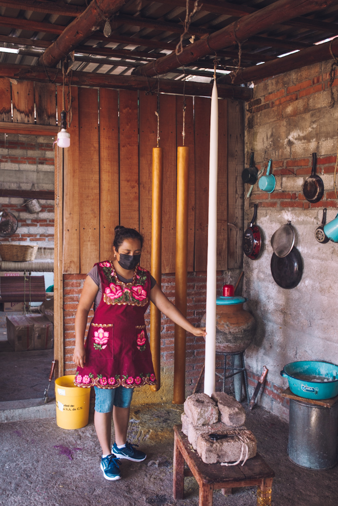 A woman leading a candle making workshop in Oaxaca, Mexico.