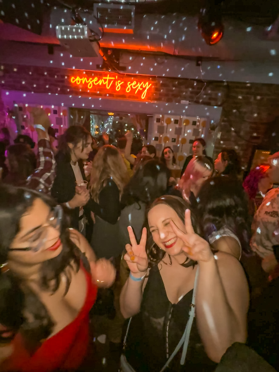 People partying inside the bar Henrietta Hudson in NYC, one of the most lesbian cities in the world.