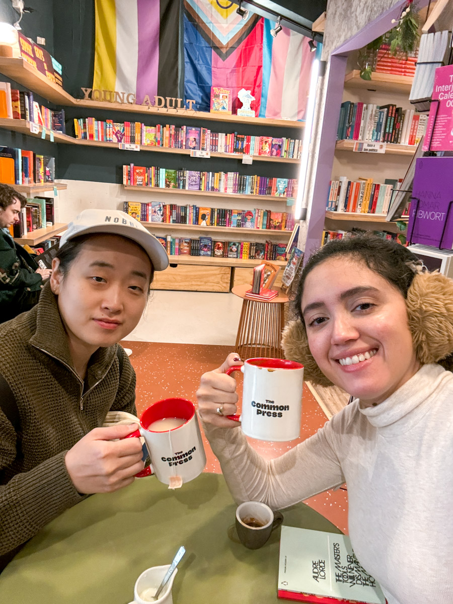 A couple having tea inside a queer lesbian space in London.