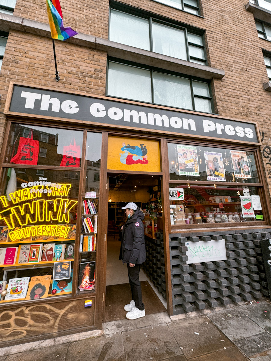 A woman entering a queer bookstore in London.