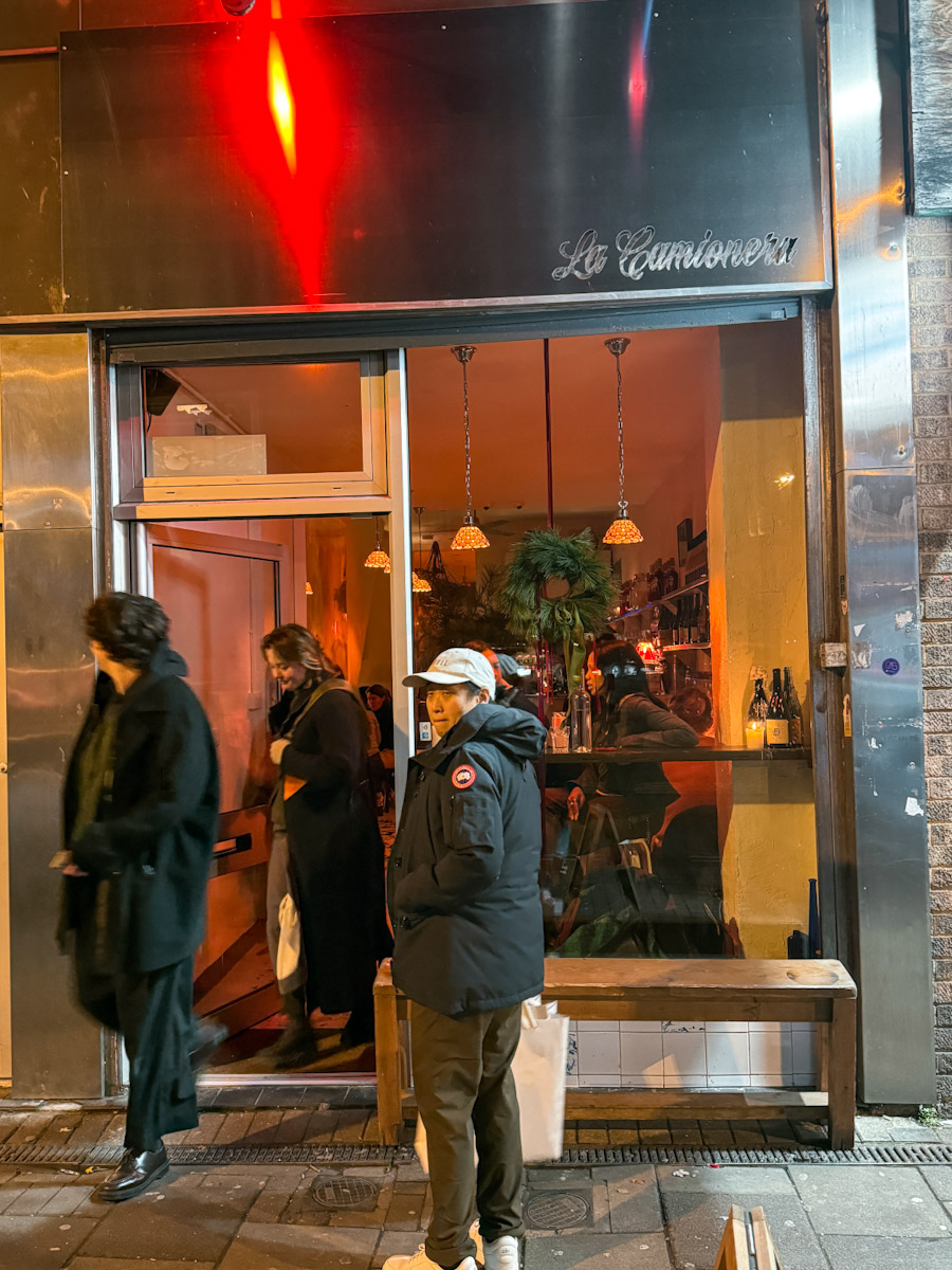 People entering and leaving a London lesbian bar.