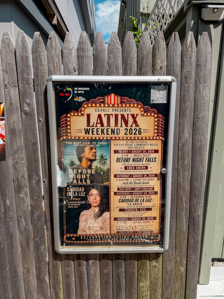 A poster that says "Latinx Weekend 2026" attached on a wooden wall.